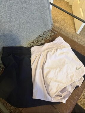 Two pair of Nike Women’s White Athletic Shorts with Built-In Liner